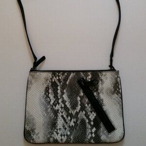 Ladies small purse or clutch in simulated snakeskin.